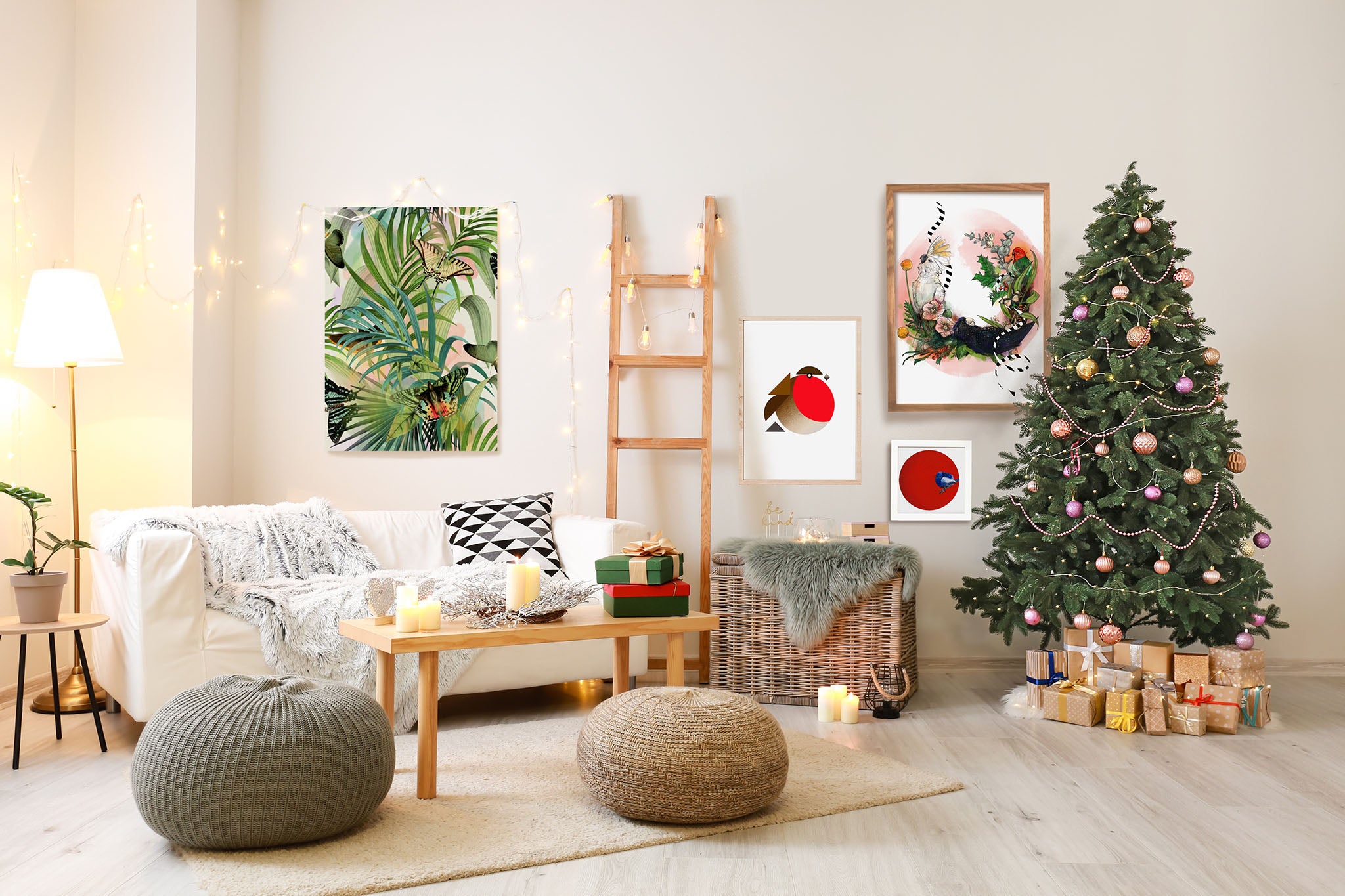 Cozy living room with a decorated Christmas tree, presents, a sofa, poufs, and several framed artworks on the wall. A ladder leans against the wall with string lights.