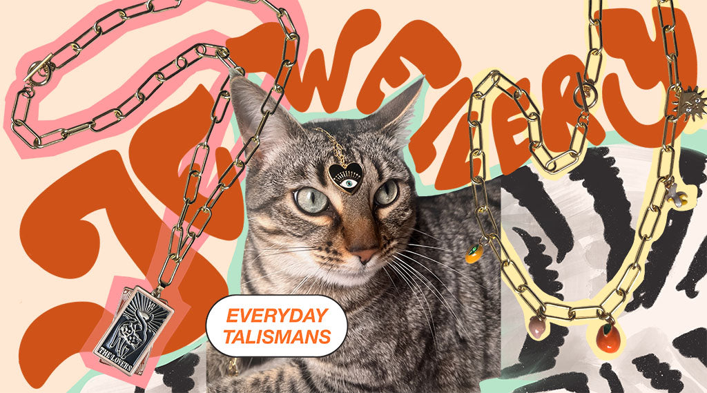 Collage featuring a tabby cat with jewelry and chains overlay, text "everyday talismans" and abstract orange shapes in the background.