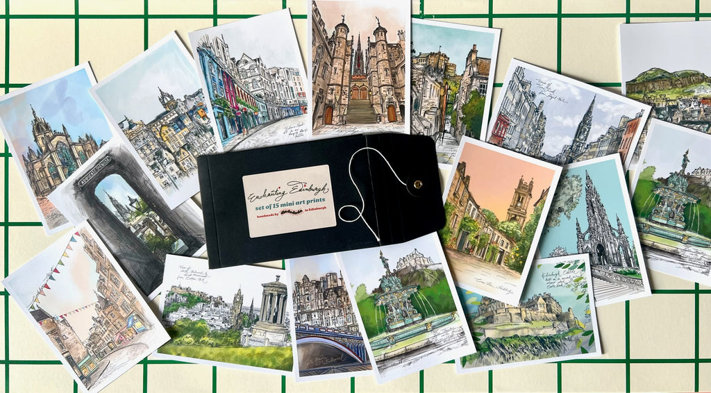 The Essential Edinburgh "Edinburgh Mini Print Set" includes 15 A6 original drawings, ideal as art prints or Scotland gifts, arranged with a black "Greetings Edinburgh" envelope on a white grid background.