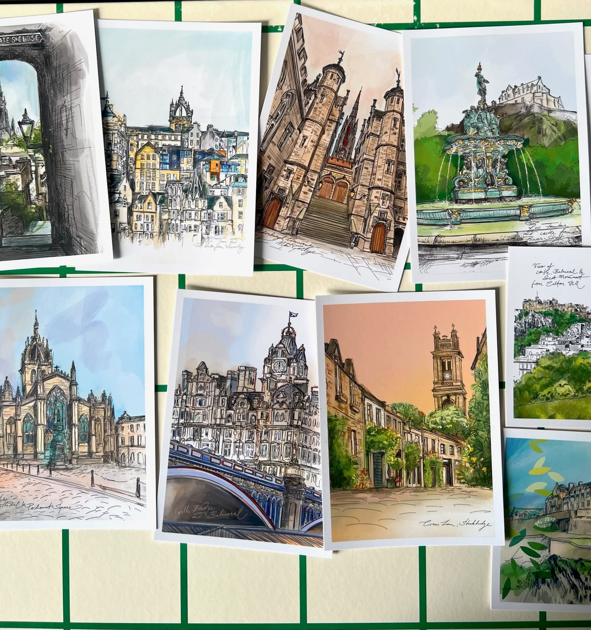 The Essential Edinburgh Mini Print Set features 15 A6 original drawings of European architecture and cityscapes—perfect as Edinburgh art prints or unique Scotland gifts—arranged on a gridded background.
