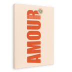The Amour Matte Canvas Print by Shromps is a beige rectangular wall art featuring bold vertical red "AMOUR," "TOUJOURS" in smaller text above, and a green "HOTEL ONLY" sticker—modern typography perfect for your gallery wall.