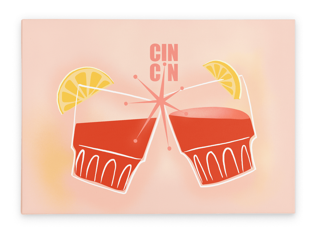 The Cin Cin Matte Canvas Print by Shromps features two illustrated cocktail glasses with lemon wedges clinking under "CIN CIN" text on a light pink background, ideal for fans of retro-inspired holiday decor.