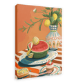 A vibrant painting from Hôtel Dodo, the Hôtel Dodo Watermelon Canvas Print, depicts a watermelon half alongside a lemon on a checkered tablecloth, evoking Mediterranean decor. The scene is further enhanced by a vase with flowers and lemons, a small dish with food, a spoon, and a tin labeled "Watermelon", adding charm to this colorful piece—perfect for any space.