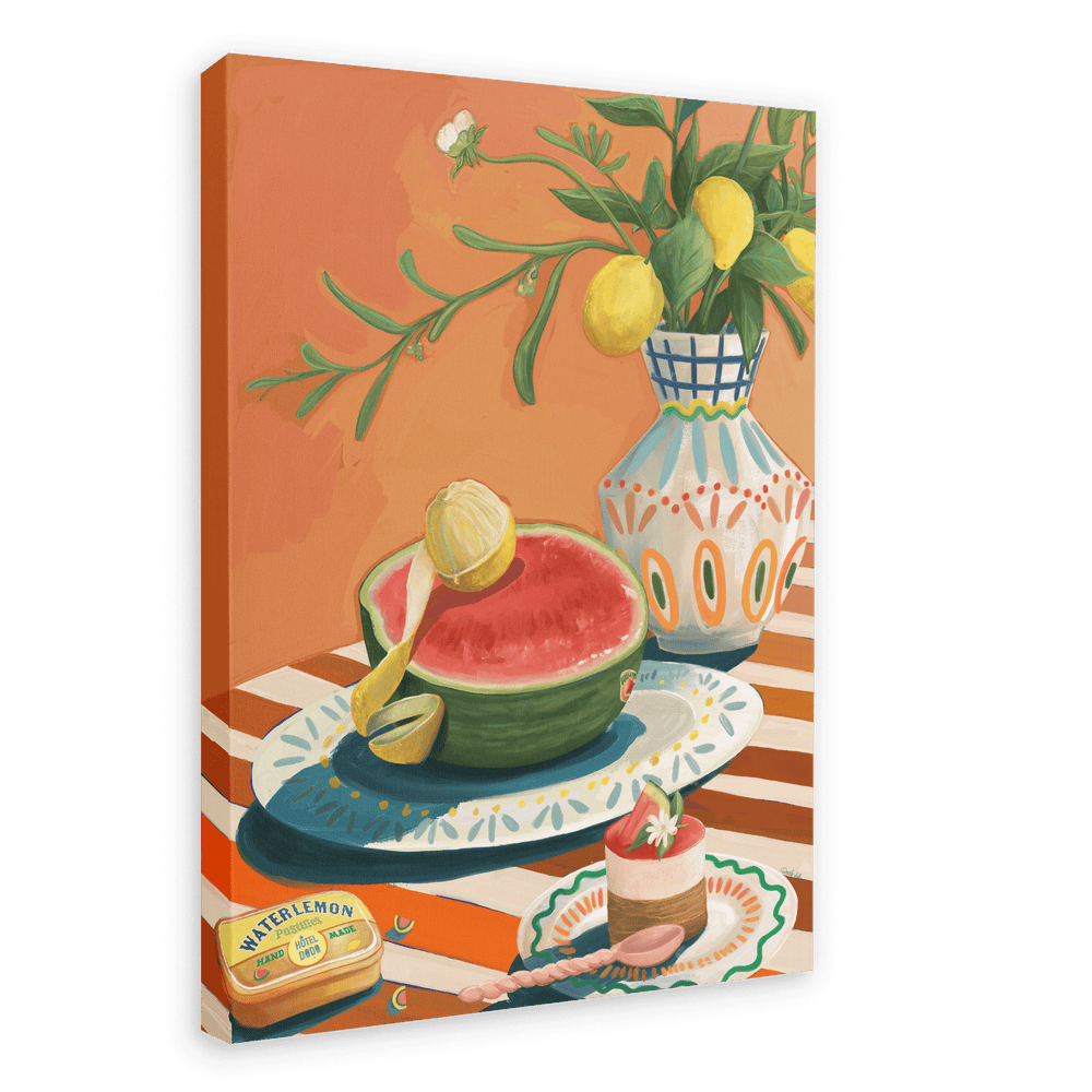 A vibrant painting from Hôtel Dodo, the Hôtel Dodo Watermelon Canvas Print, depicts a watermelon half alongside a lemon on a checkered tablecloth, evoking Mediterranean decor. The scene is further enhanced by a vase with flowers and lemons, a small dish with food, a spoon, and a tin labeled "Watermelon", adding charm to this colorful piece—perfect for any space.