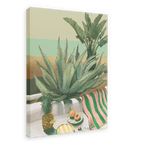 Framed artwork titled Âllo Aloe (feat. Pineapple Duckie) by Hôtel Dodo, featuring a tropical scene with green plants, a pineapple, a cut peach, and a green and pink striped towel captured on canvas.