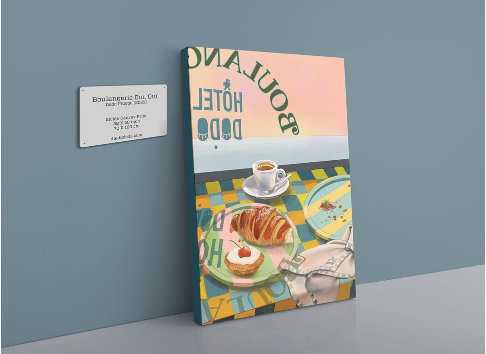 A Boulangerie Oui, Oui Giclée Canvas Print depicting a stylized breakfast scene with pastries and coffee on a table, placed against a blue wall near a plaque with contact details.CreatedBy: Hôtel Dodo