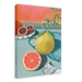 The Mellow Pomelo Giclée Canvas Print by Hôtel Dodo portrays a still-life scene with a sliced grapefruit, a whole grapefruit, and a blood orange on a blue table. Some leaves and a piece of paper are also included, set against an orange gradient background.