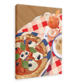 Set the scene with the Pizzeria Gabbiano Giclée Canvas Print by Hôtel Dodo, featuring a picturesque table setting of a plate of pizza adorned with basil, tomatoes, olives, and mozzarella, alongside a bowl of spaghetti and a glass of orange cocktail on a red and white checkered tablecloth.