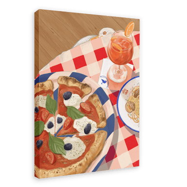 Set the scene with the Pizzeria Gabbiano Giclée Canvas Print by Hôtel Dodo, featuring a picturesque table setting of a plate of pizza adorned with basil, tomatoes, olives, and mozzarella, alongside a bowl of spaghetti and a glass of orange cocktail on a red and white checkered tablecloth.