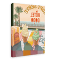 Vibrant canvas print featuring two ice cream cones in front of a seaside view, with "Hôtel Dodo" visible in the background. The tropical foliage adds a lush vibe to the scene. The giclée print, titled "Soft Serve," includes a stack of what appears to be postcards.