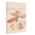 A beach scene featuring various seashells, a piece of coral, and a striped feather arranged on the sand, showcasing the Tiny Treasures Giclée Canvas Print by Hôtel Dodo. The ocean is visible in the background, evoking calm moments by the sea.