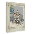 The “Bobcat In A Suit Canvas Print” by Animals In Suits features a whimsical bobcat with a human body dressed in a suit, set before a mountain landscape and framed by blue flowers—blending the allure of vintage botanical illustration with an inventive take on traditional bobcat art.