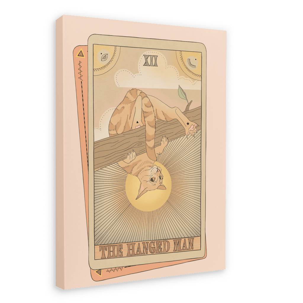 Tarot Cats’ “The Hanged Man Canvas Print” features a tarot card illustration of a cat hanging upside down by its tail from a branch, with sun rays in the background.