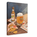 A beer bottle, a foamy mug displaying the “Beastie Bräu” logo, an open bag of potato chips, and coasters rest on a wooden table in bright light in this Hôtel Dodo giclée canvas print.