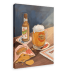 A beer bottle, a foamy mug displaying the “Beastie Bräu” logo, an open bag of potato chips, and coasters rest on a wooden table in bright light in this Hôtel Dodo giclée canvas print.