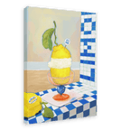 A giclée canvas print by Hôtel Dodo, titled “Amalfi Limoni,” depicting a lemon sorbet with cream in a glass dish on a tiled surface and set against a blue and white checkered background reminiscent of the Amalfi coast, featuring a “That’s my jam” sticker.