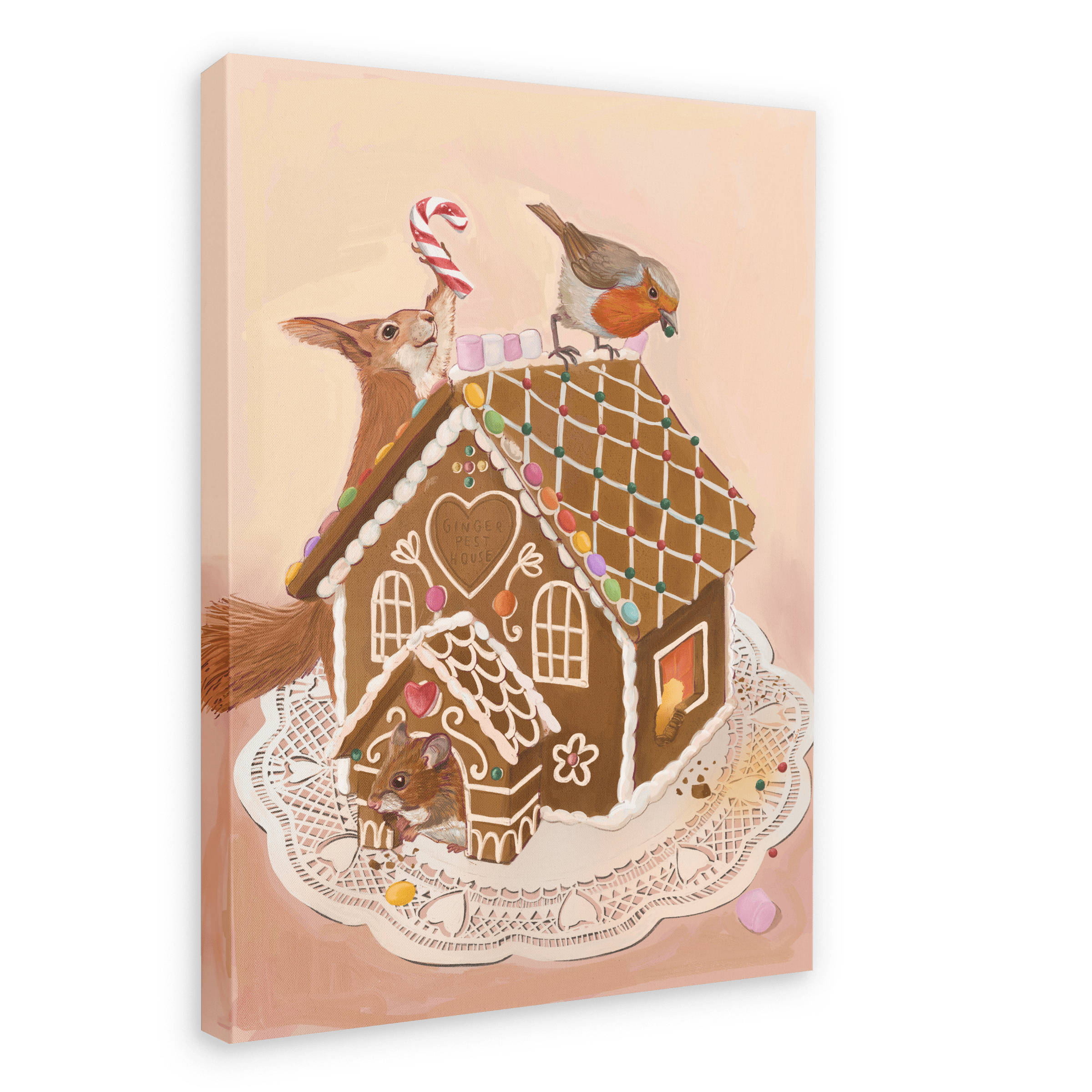 A Gingerpest House Giclée Canvas Print by Kitsch Kanaveral featuring a gingerbread house adorned with colorful candy decorations on a lace doily, with a squirrel and bird peering over it, accompanied by another small animal near the entrance.
