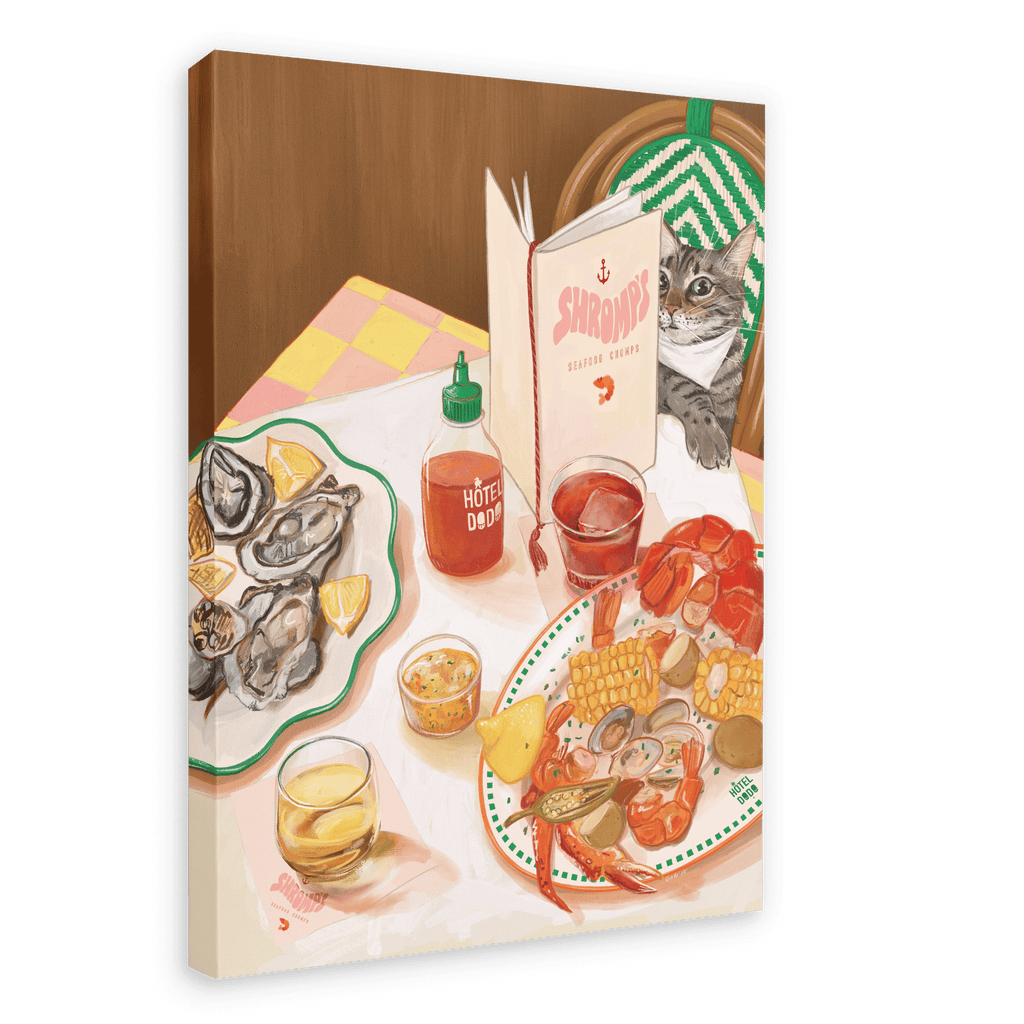 Depiction of a lively seafood restaurant scene featuring the Shromp’s Seafood Chomps Giclée Canvas Print by Hôtel Dodo, illustrating a table set with seafood, oysters, drinks, hot sauce, and a cat seated on a chair reading a menu titled “Shrimps.”.