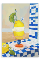 An Amalfi Limoni Giclée Canvas Print by Hôtel Dodo is displayed on a tiled surface, featuring a painted lemon sorbet dessert in a glass dish against a beach scene inspired by the Amalfi coast.