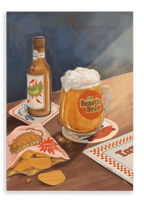 A pint of frothy beer, a brown bottle, a bag of potato chips, and coasters sit on a wooden table under a shaft of light in the “Beastie Bräu Giclée Canvas Print” by Hôtel Dodo.
