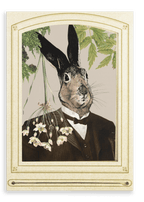 The Hare In A Suit Canvas Print by Animals In Suits features a rabbit’s head atop a human body dressed in a suit and tie, posed in vintage portrait style among flowers and green leaves, evoking the charm of handmade collage art and vintage botanical illustrations.
