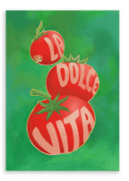 The Pomodori La Dolce Vita Giclée Canvas Print by Intercontinental Fruitery showcases a trio of vibrant red tomatoes, a versatile fruit, set against a lush green backdrop, with the artistic inscription "La Dolce Vita" featured on them.