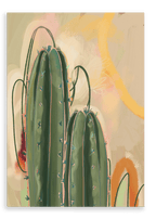 The "Saguaro Sundown Giclée Canvas Print" by Heat Flares features a digital illustration of three green cacti with long, thin spines set against a blurred, pastel background of beige, pink, and yellow hues.