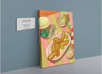 A vibrant giclée canvas print from Hôtel Dodo, titled “Frickle Feast,” showcases a painting of fried pickles, sauces, a drink, and dessert—capturing the lively essence of the Pickle Festival—displayed on the wall with a title plaque.