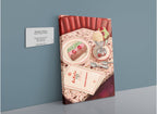 A Hôtel Dodo “Gelato Gatto” Giclée Canvas Print depicts a table set with a dessert, ice cream sundae, three spoons, a menu, and a napkin. A wall plaque in the artwork reads: “Gelato Gatto” along with additional details.