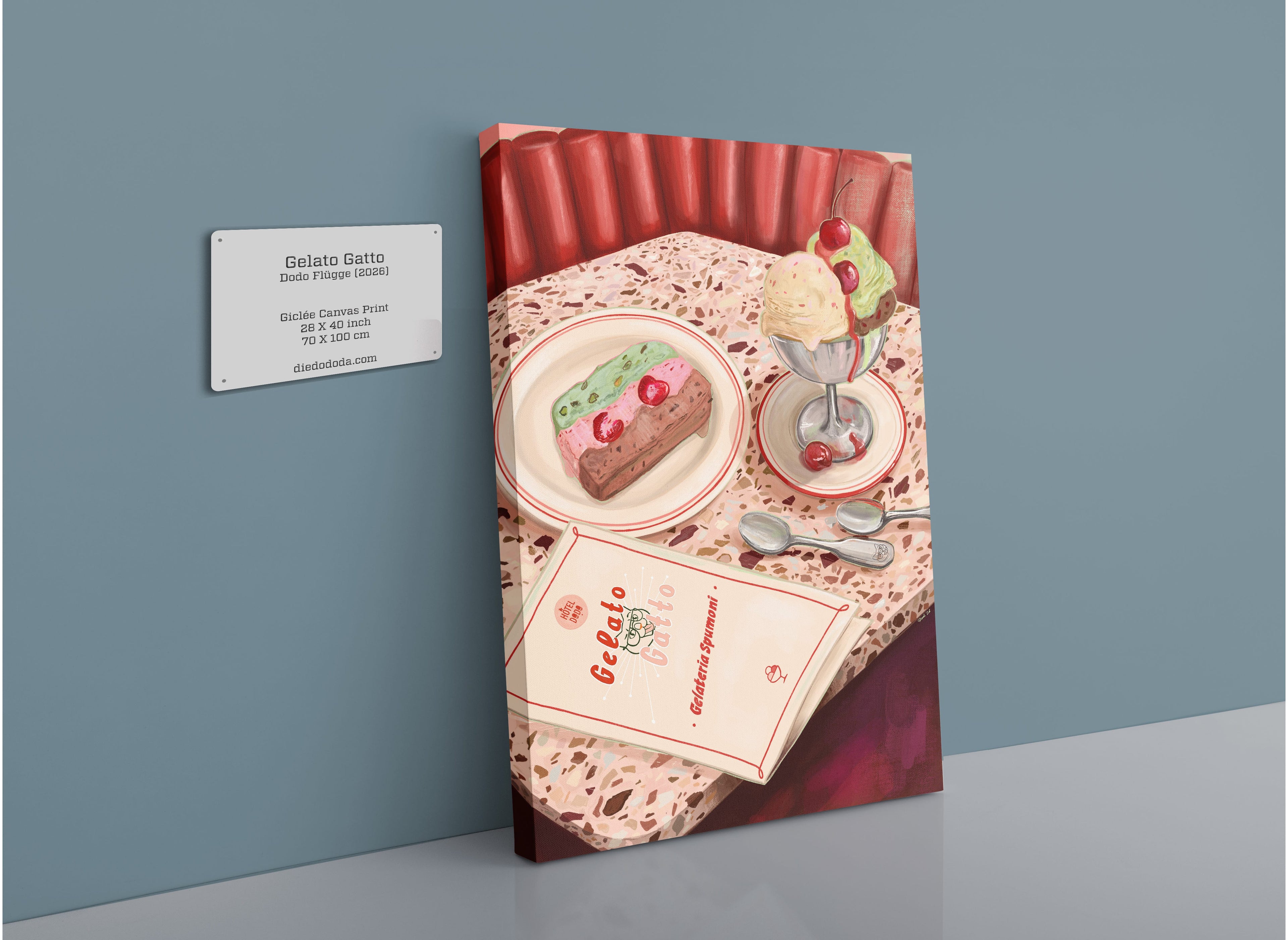 A Hôtel Dodo “Gelato Gatto” Giclée Canvas Print depicts a table set with a dessert, ice cream sundae, three spoons, a menu, and a napkin. A wall plaque in the artwork reads: “Gelato Gatto” along with additional details.