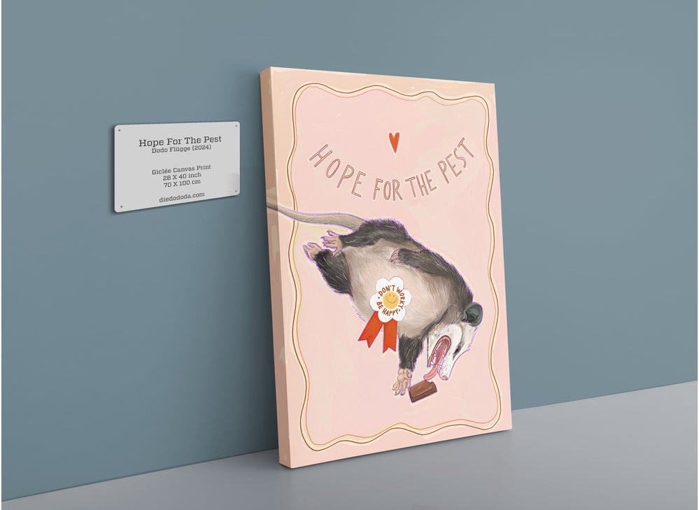 A matte canvas print titled "Hope For The Pest" from International Pestsellers, featuring a possum adorned with an award ribbon, displayed on a wall with a placard that details the title, artist, and print information.