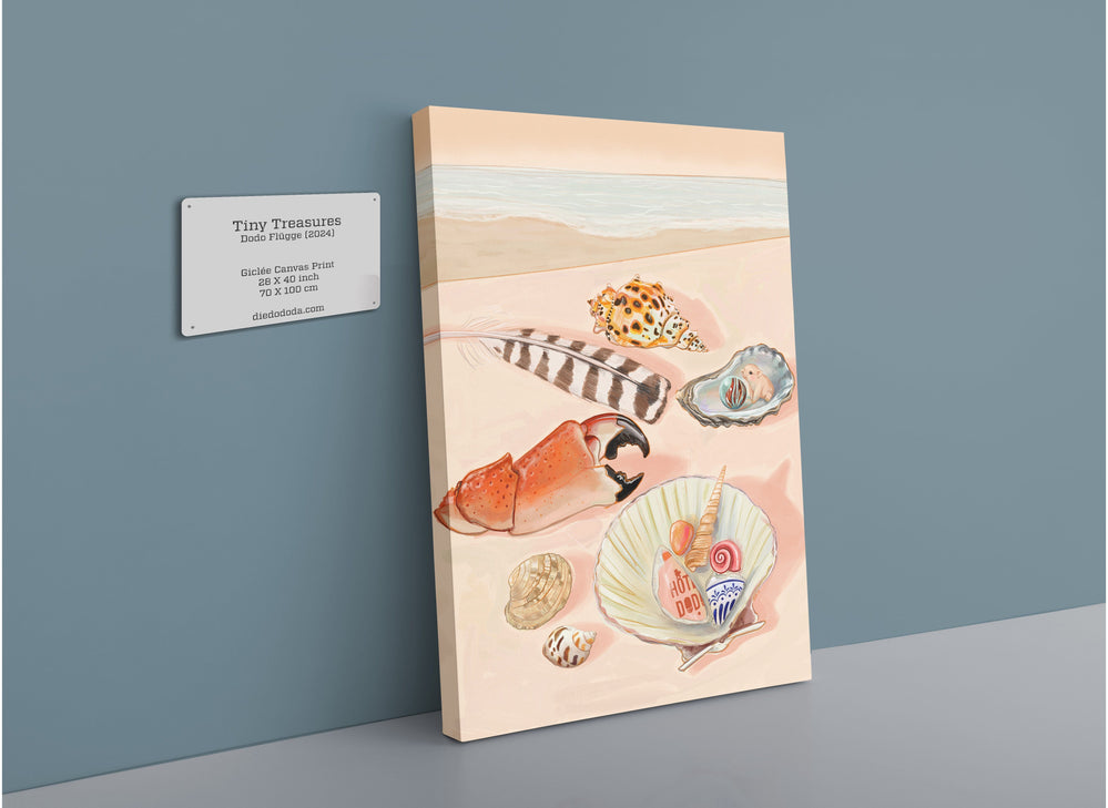 The Hôtel Dodo "Tiny Treasures Giclée Canvas Print," featuring intricate illustrations of various seashells and oceanic elements, is displayed against a neutral wall with a descriptive plaque beside it.