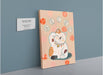 The "Maneki-Neko Giclée Canvas Print" from Kitsch Kanaveral features a stylized Japanese lucky cat adorned with decorative balls, symbolizing good fortune. A descriptive plaque is mounted to the left of the artwork.