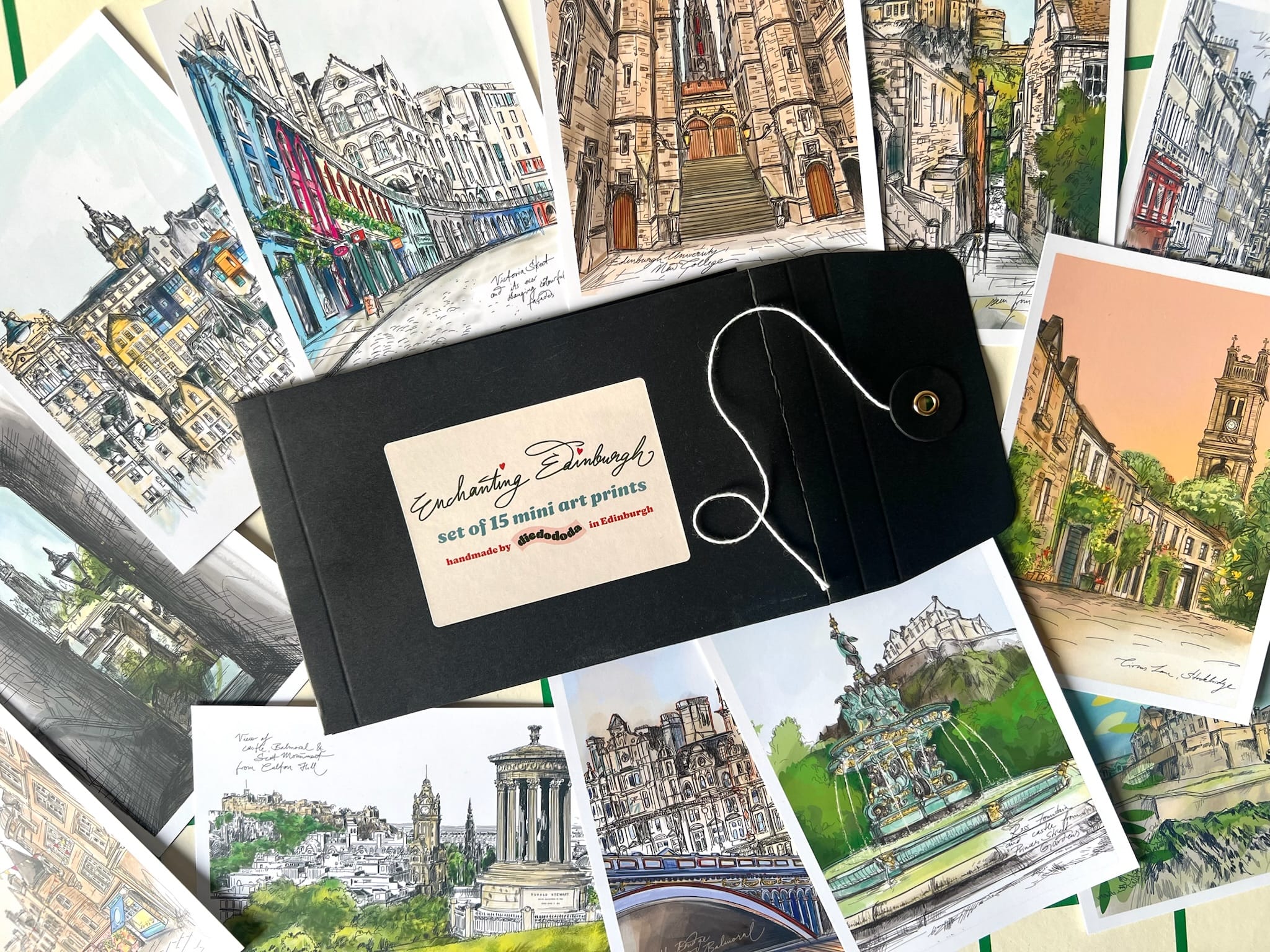 The Essential Edinburgh Mini Print Set includes 15 A6 original drawings in a black envelope—unique cityscape postcards that make a perfect Edinburgh souvenir or thoughtful Scotland gift.