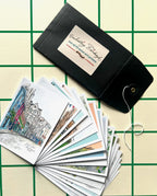 An open black envelope labeled "Edinburgh Mini Print Set | 15 A6 Original Drawings" by Essential Edinburgh displays illustrated art prints—an ideal unique Edinburgh souvenir or thoughtful Scotland gift.