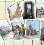The Edinburgh Mini Print Set by Essential Edinburgh features 15 A6 original city scene drawings—streets, historic buildings, and landmarks—arranged on a grid background, making it an ideal souvenir or Scotland gift.