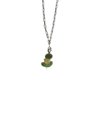 The Canapé Cutie Necklace by Necklaces features a frog-shaped pendant with a top hat, set against a black background.