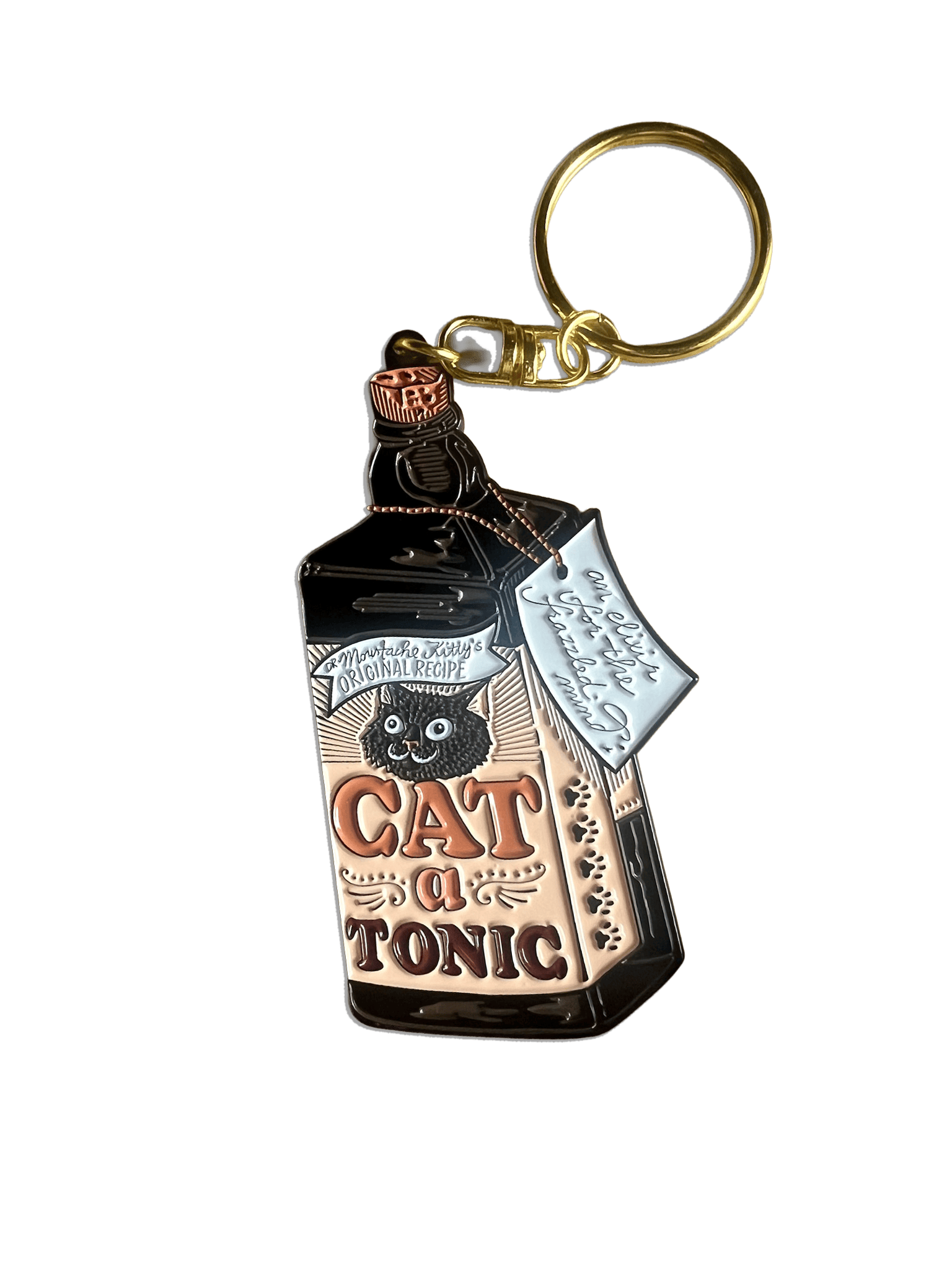 The Catatonic Keyring by Hôtel Dodo is an enamel keyring shaped like a vintage tonic bottle, featuring a black cat and 
