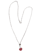 The Mon Chérie Necklace by Necklaces features a silver curb chain heart adorned with a red cherry pendant.