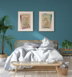 A bedroom featuring a rattan bed, white bedding, The Emperor Matte Art Print by Tarot Cats on a teal wall, potted plants, a bench, and a nightstand adds whimsy—perfect for any Tarot Cats or feline enthusiast.