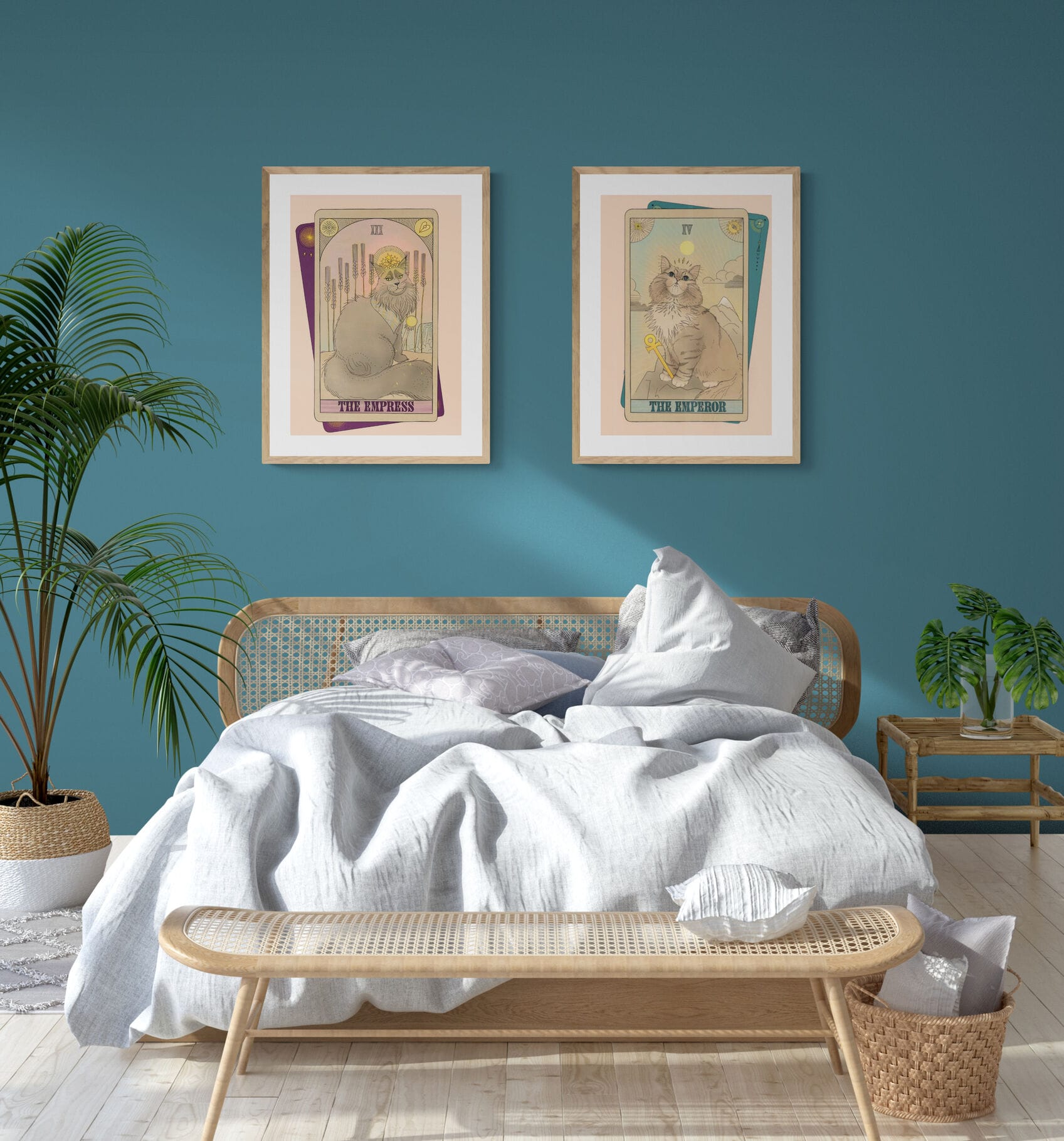 A bedroom featuring a rattan bed, white bedding, The Emperor Matte Art Print by Tarot Cats on a teal wall, potted plants, a bench, and a nightstand adds whimsy—perfect for any Tarot Cats or feline enthusiast.