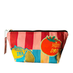 The Fruity Pick ‘n’ Mix Pouch by Hôtel Dodo is a zippered handmade cotton organiser with red and yellow stripes, playful tomato and lemon illustrations, and “Hôtel Dodo” branding—perfect for carrying market day essentials.