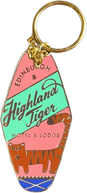 Introducing the Highland Tiger Hotel Keyring Light by Essential Edinburgh—a retro-style keyring that reads “Edinburgh Highland Tiger Hotel & Lodge” and showcases an illustrated tiger. Finished with an enamel tag, it doubles as a bag charm or distinctive keepsake.