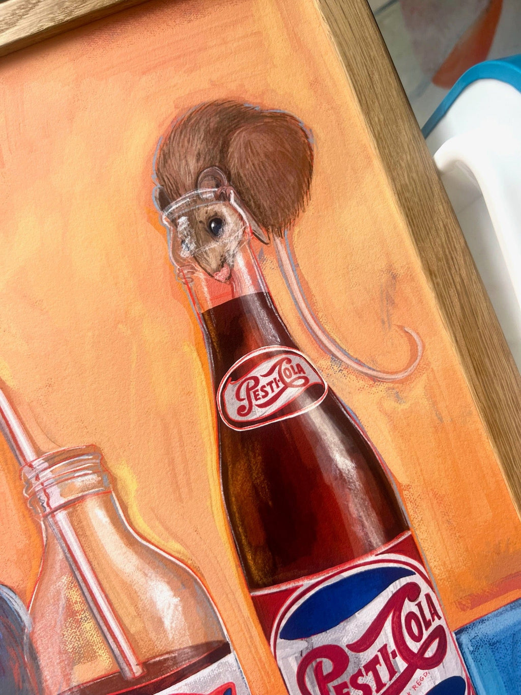 The Pesti Cola Giclée Art Print by Kitsch Kanaveral shows a mouse in a soda bottle cap hat atop a glass Pesti Cola bottle, evoking vintage full sugar flavor with other bottles in the scene.