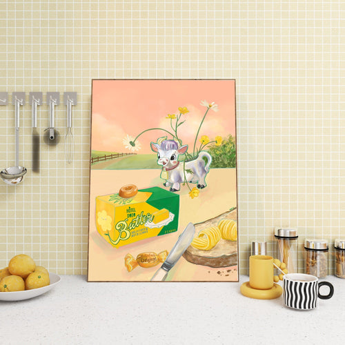 The Butterlicious Giclée Art Print by Hôtel Dodo features a cow, butter box, and knife on a kitchen counter with lemons, striped mug, utensils, and jars, evoking the calm of an Hôtel Dodo mind palace.