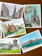 The Enchanting Edinburgh Mini Art Print Set by Essential Edinburgh features five illustrated postcards of iconic landmarks—an ideal souvenir gift for lovers of Edinburgh’s scenery and architecture.