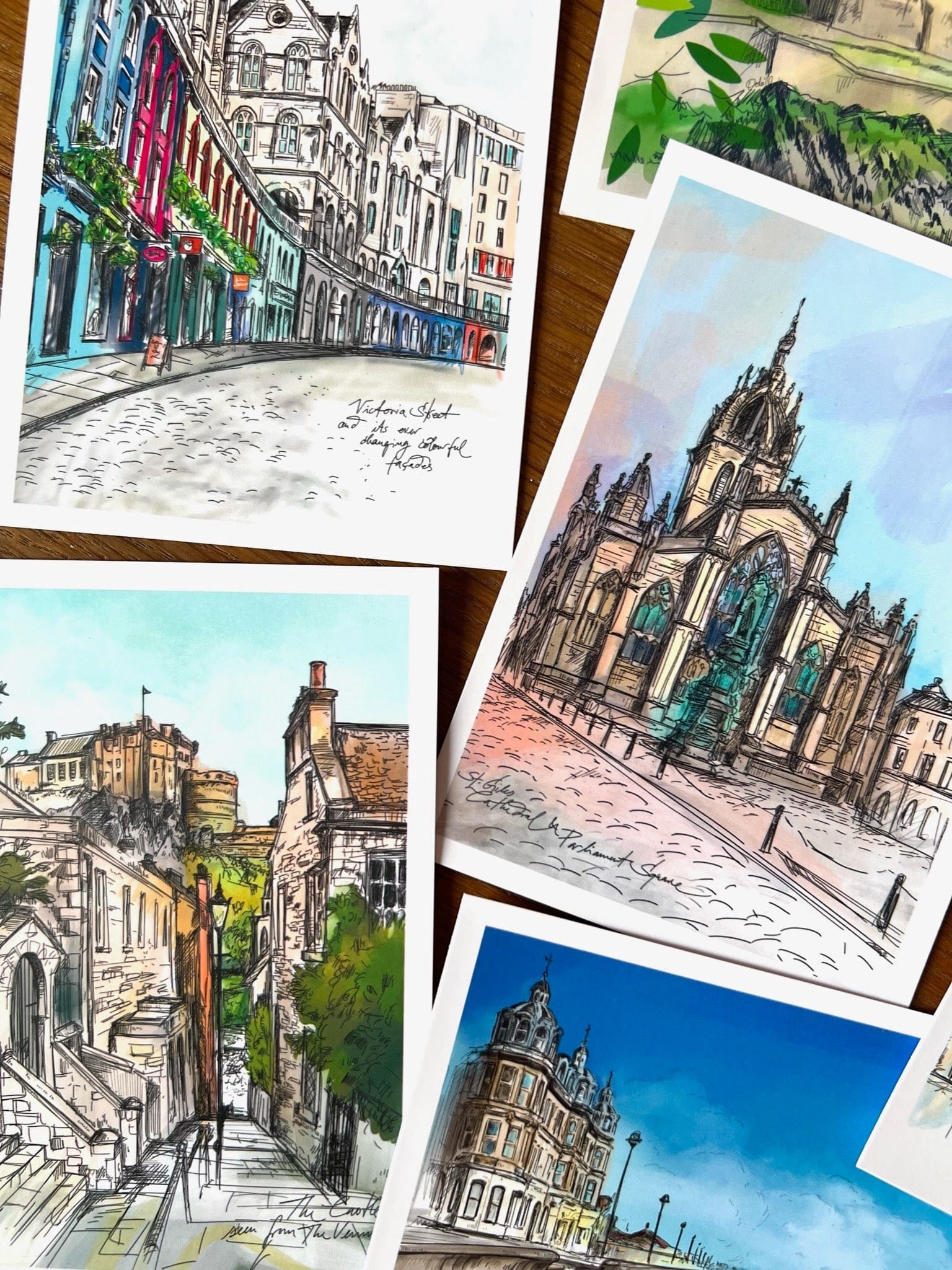 The Enchanting Edinburgh Mini Art Print Set by Essential Edinburgh features vibrant European cityscapes and iconic landmarks—an ideal souvenir gift with detailed architectural and street scenes.