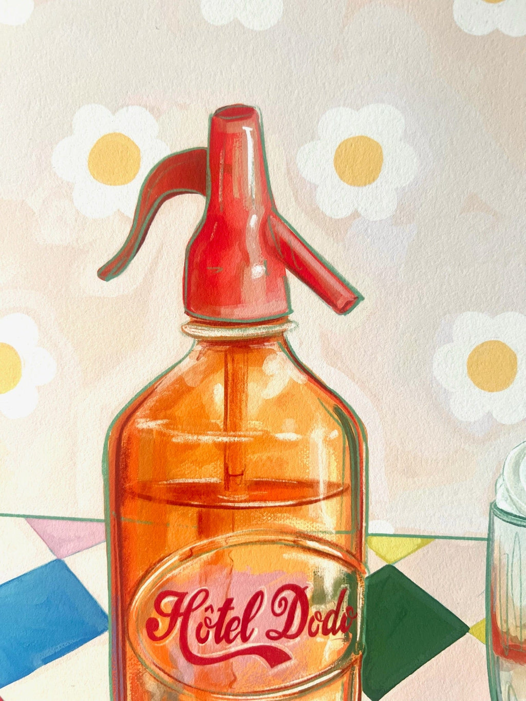 The Fat Finch Soda Giclée Art Print by Hôtel Dodo features an orange glass bottle with a red siphon on colorful tiles and a floral-patterned backdrop, capturing retro soda float charm.