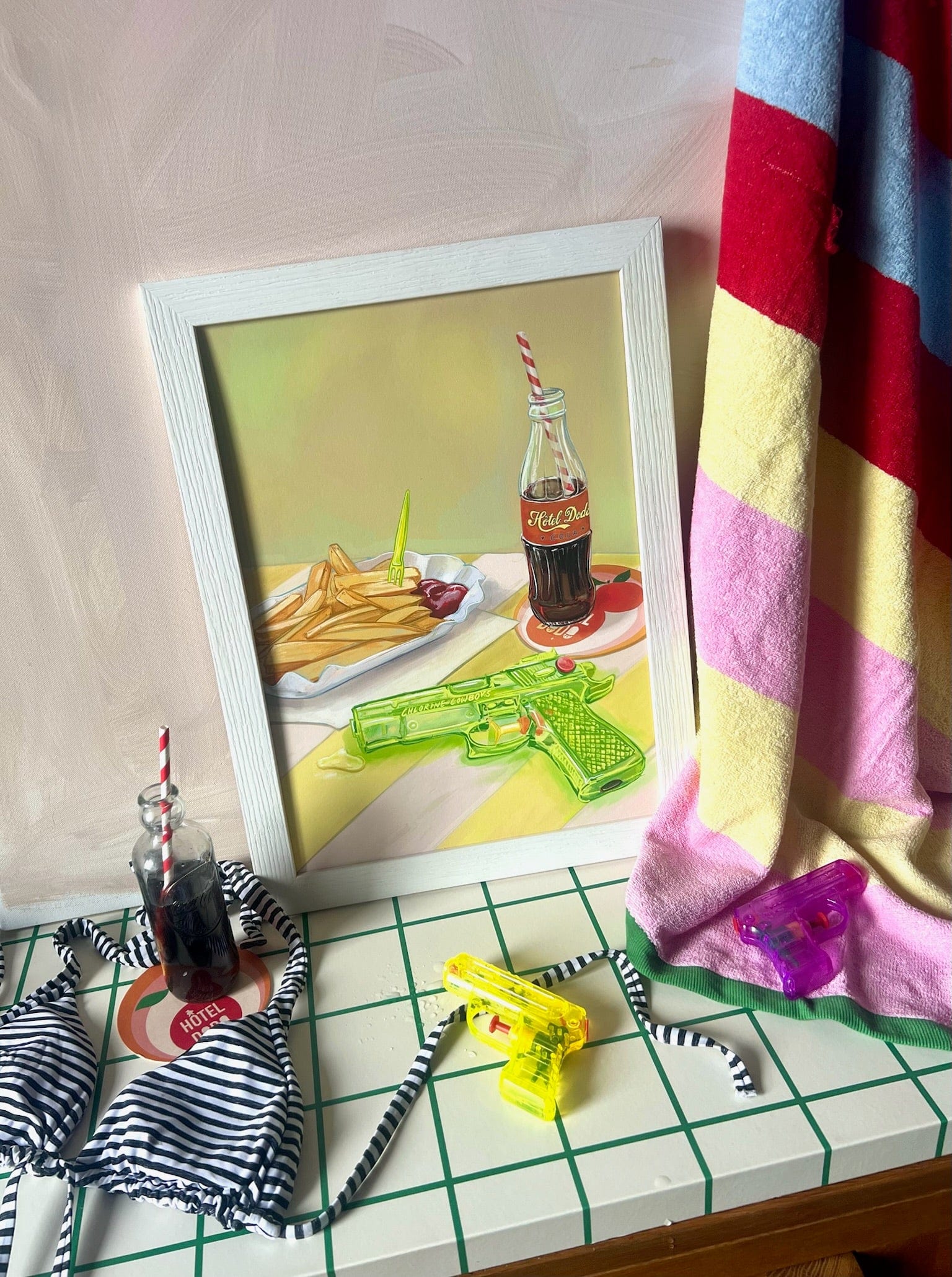 The Chlorine Cowboys Giclée Art Print by Hôtel Dodo features a framed scene with fries, ketchup, soda, and playful summer items—capturing nostalgic memories and the carefree spirit of Hôtel Dodo.
