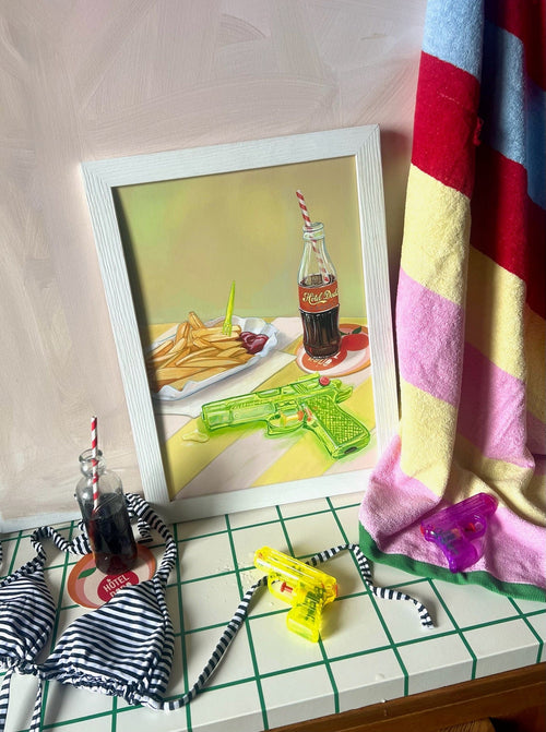 The Chlorine Cowboys Giclée Art Print by Hôtel Dodo features a framed scene with fries, ketchup, soda, and playful summer items—capturing nostalgic memories and the carefree spirit of Hôtel Dodo.